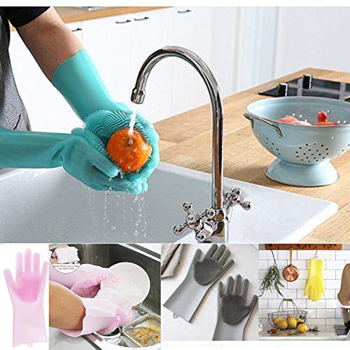 Teal silicone dishwashing glove scrubbing an orange sponge near a kitchen sink