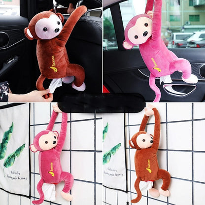 Plush monkey tissue holders in brown and pink, hanging on car seat and door