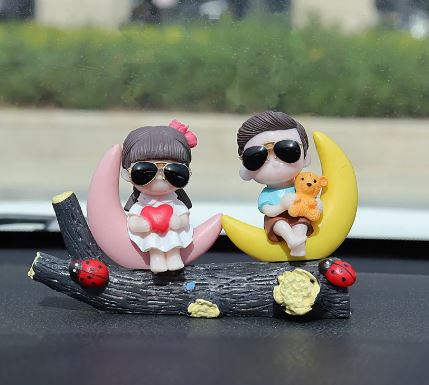 Couple car decoration figurines sitting on crescent moon with teddy bear accessory
