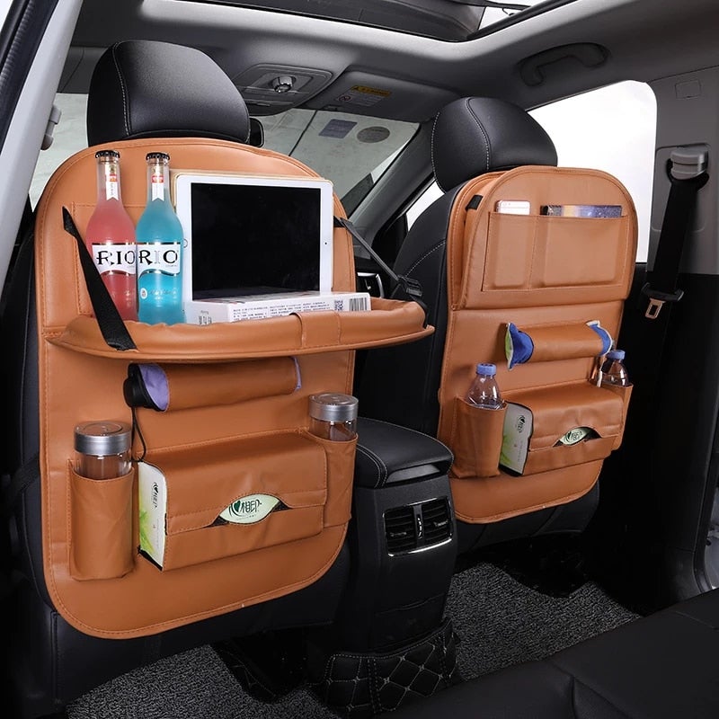 Car seat organizer with tray in tan leather; two front-seat organizers with bottle and pouch storage.