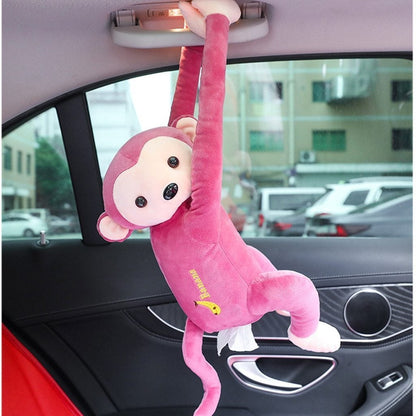 Pink plush monkey tissue holder, hanging with tissue cover in car interior