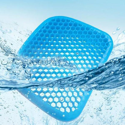 Blue silicone egg cushion with hex-grid surface and water beading