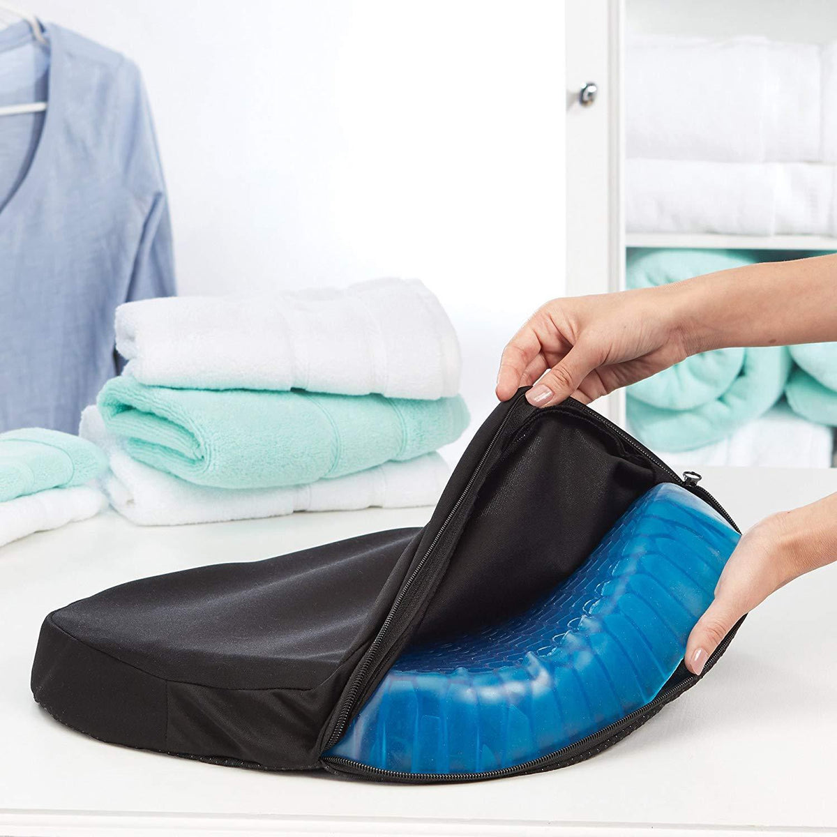 Egg seat cushion with black cover and blue hex-pattern base, folded open