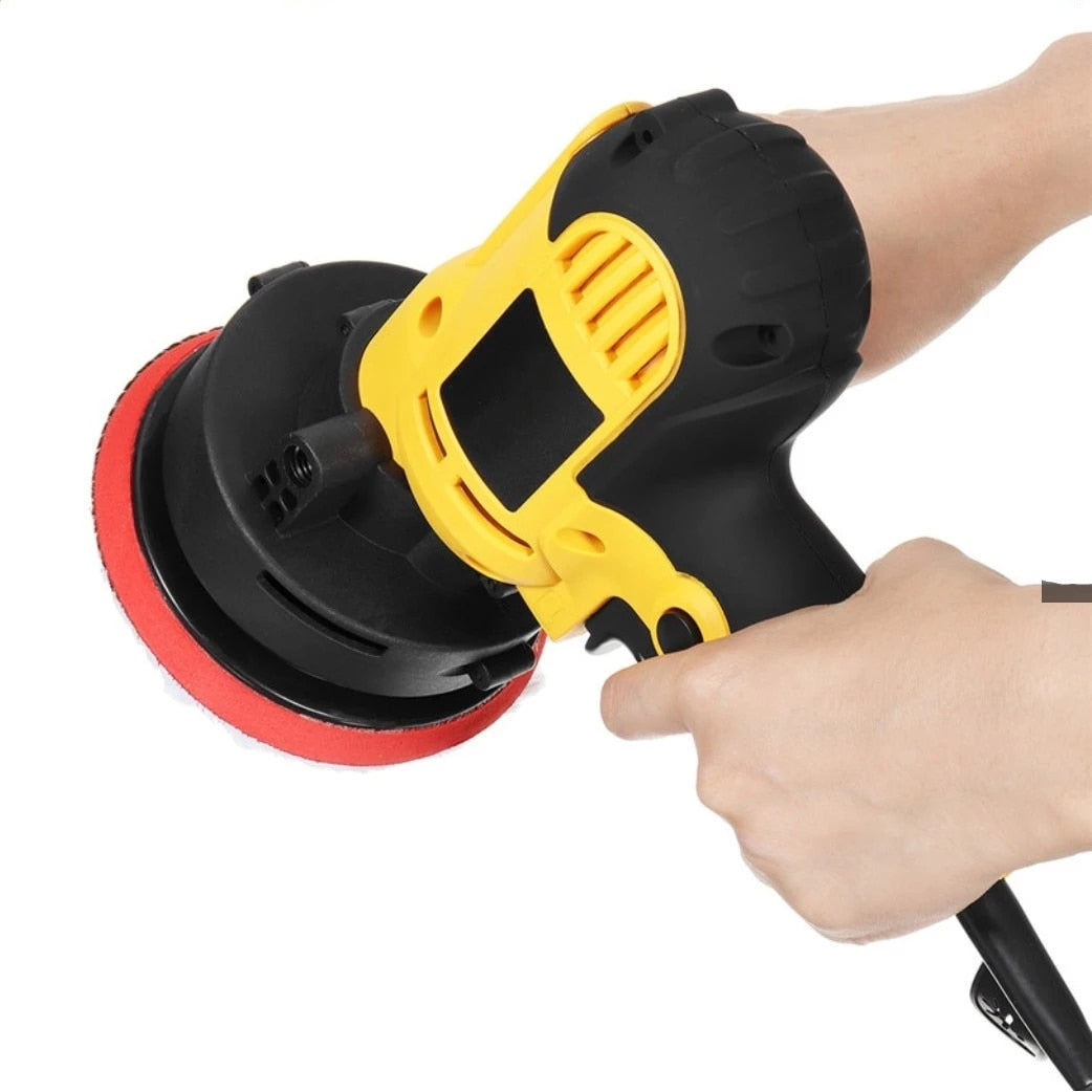 Electric car polisher with yellow housing and red foam edge polishing pad, right-hand grip