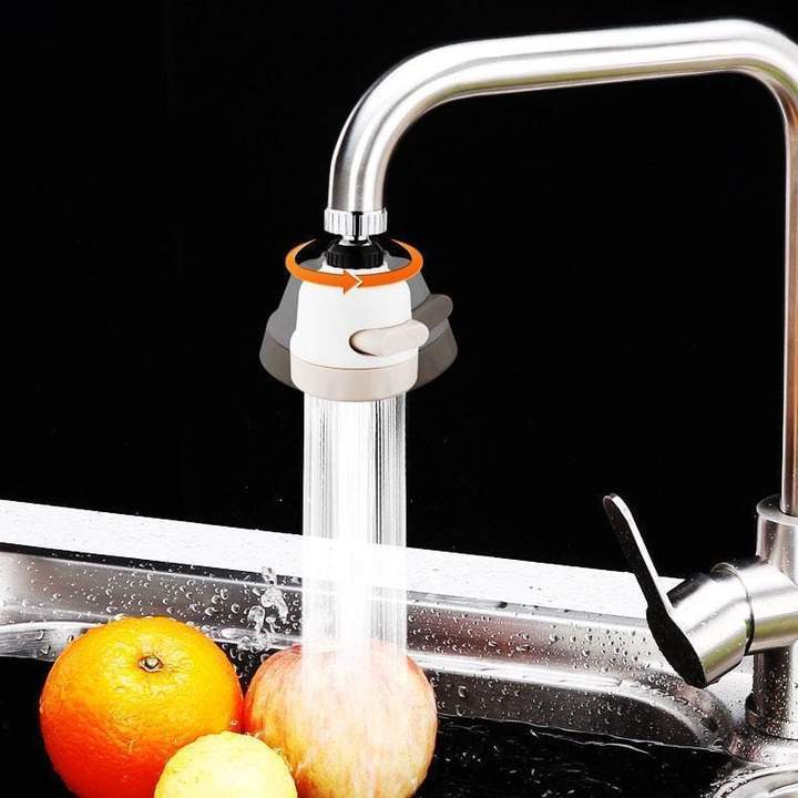 White faucet aerator on curved sink faucet, water flowing through the outlet