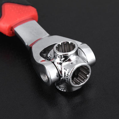 Close-up of chrome socket head on universal wrench with red handle