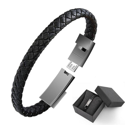 Black braided leather USB bracelet charger with USB plug and open gift box.