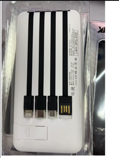 White power bank in plastic packaging with label and multiple charging output ports.