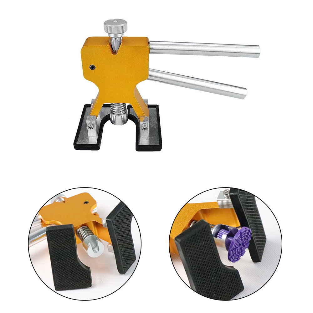 Gold paintless dent repair tool with black clamp pads and spring-loaded plunger