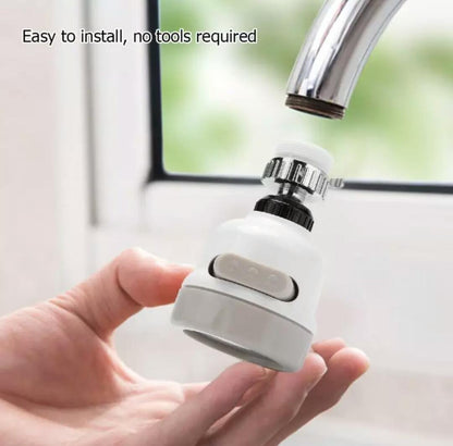 White 3-mode faucet aerator held in hand with mode button and chrome connection