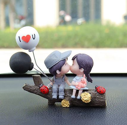 Couple car figurine set kissing with blue cap, heart balloon, and ladybug accents