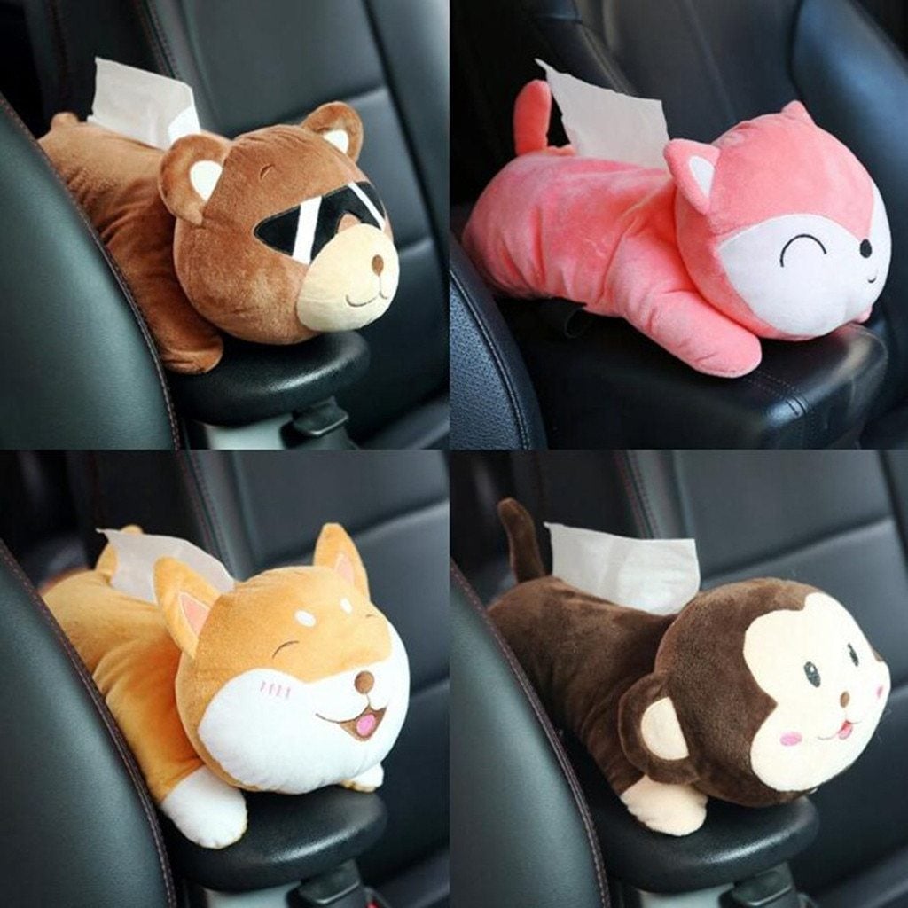 Plush monkey tissue holder close-up on car seat, assorted brown and pink plush heads