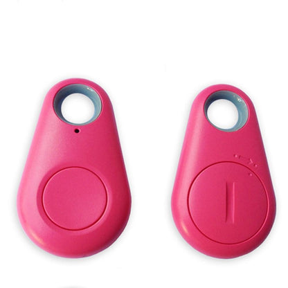 Pink Bluetooth tracker tags, each with lanyard hole and round button.